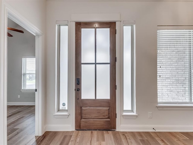 8509 NW 125th St, Oklahoma City, OK 73142 - foyer entrance featuring baseboards, wood finished floors, and a ceiling fan