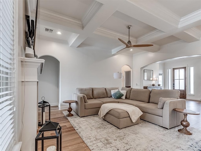 8509 NW 125th St, Oklahoma City, OK 73142 - living area featuring arched walkways, ceiling fan, beam ceiling, ornamental molding, and coffered ceiling