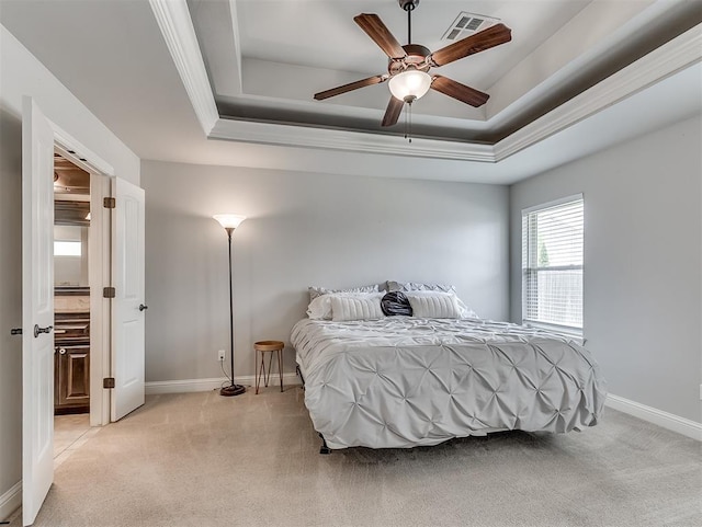 8509 NW 125th St, Oklahoma City, OK 73142 - bedroom with a tray ceiling, light carpet, baseboards, a ceiling fan, and crown molding