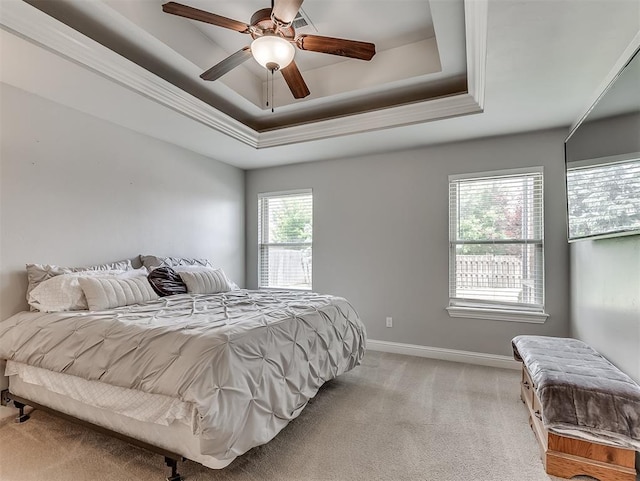 8509 NW 125th St, Oklahoma City, OK 73142 - bedroom featuring a raised ceiling, light carpet, baseboards, and a ceiling fan