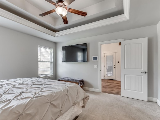 8509 NW 125th St, Oklahoma City, OK 73142 - bedroom with a tray ceiling, light carpet, baseboards, crown molding, and ceiling fan