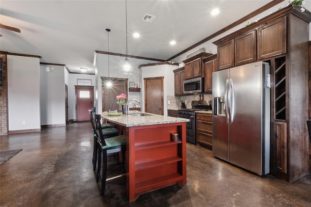 kitchen with appliances with stainless steel finishes, a sink, ornamental molding, backsplash, and light stone countertops