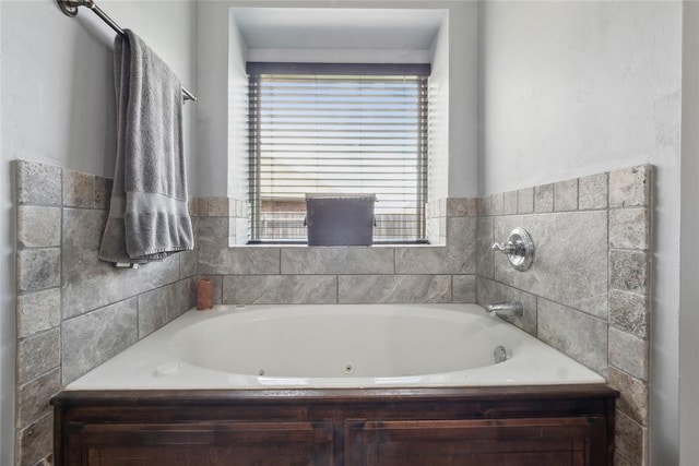 full bathroom with a jetted tub
