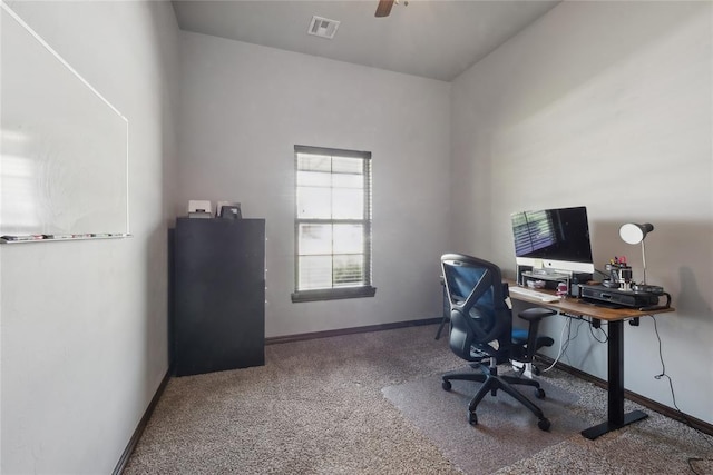 office area featuring carpet, baseboards, and a ceiling fan