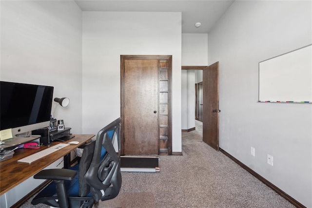 carpeted office with baseboards