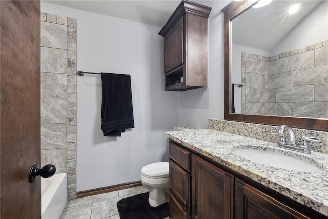 full bathroom with toilet, vanity, lofted ceiling, and baseboards