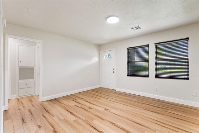 1225 NW 99th St, Oklahoma City, OK 73114 - empty room featuring light wood-style flooring and baseboards