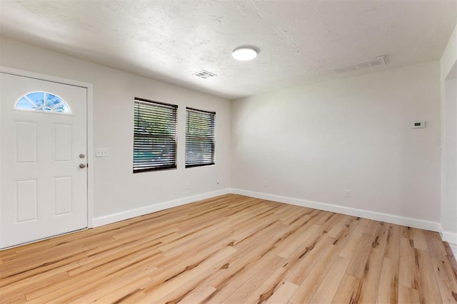 1225 NW 99th St, Oklahoma City, OK 73114 - entrance foyer with light wood-style flooring, plenty of natural light, and baseboards