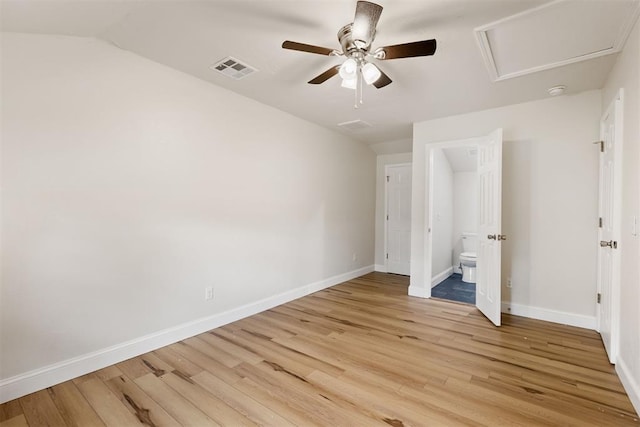 1225 NW 99th St, Oklahoma City, OK 73114 - unfurnished bedroom with light wood-style flooring, baseboards, ensuite bath, a ceiling fan, and lofted ceiling