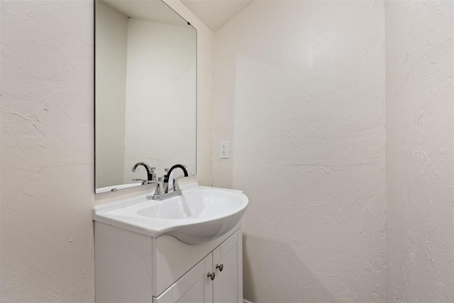 1225 NW 99th St, Oklahoma City, OK 73114 - bathroom with vanity and a textured wall