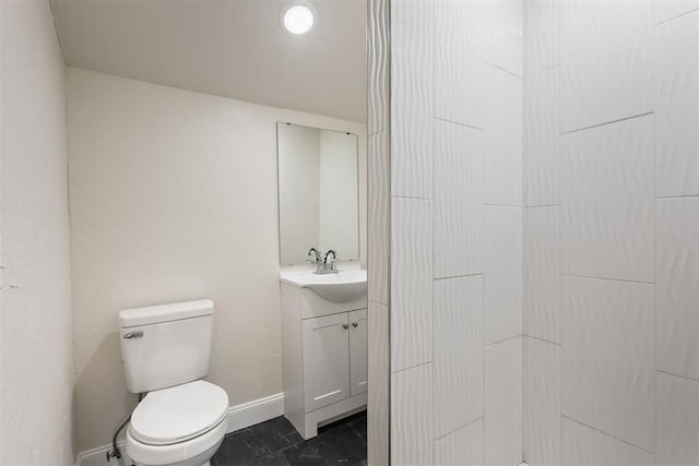 1225 NW 99th St, Oklahoma City, OK 73114 - bathroom with vanity, toilet, and baseboards
