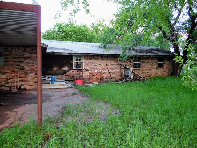 view of side of property with brick siding