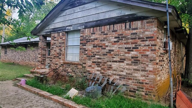 17 S Cemetery Rd, Tuttle, OK 73089 - view of property exterior featuring brick siding