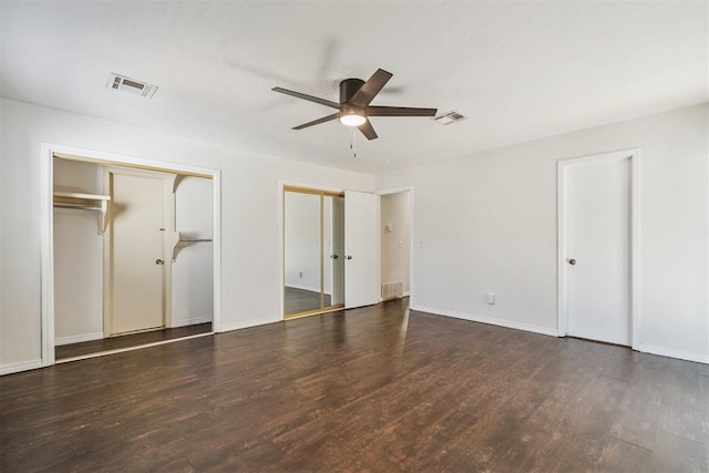 2220 NW 47th St, Oklahoma City, OK 73112 - unfurnished bedroom with two closets, wood finished floors, and ceiling fan