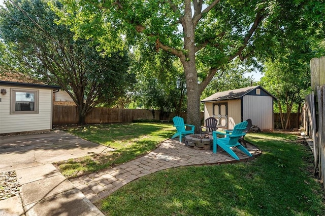 2220 NW 47th St, Oklahoma City, OK 73112 - fenced backyard with a patio area, a storage unit, and a fire pit