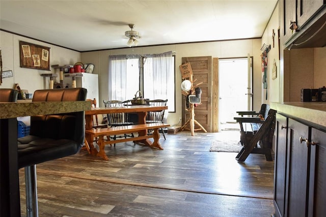 300746 Mcaly Rd, Foster, OK 73434 - dining room featuring wood finished floors, ornamental molding, and a ceiling fan
