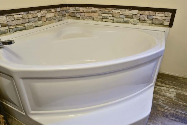 300746 Mcaly Rd, Foster, OK 73434 - bathroom view of wood finished floors and a tub