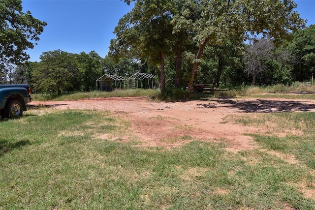 300746 Mcaly Rd, Foster, OK 73434 - view of yard with a carport