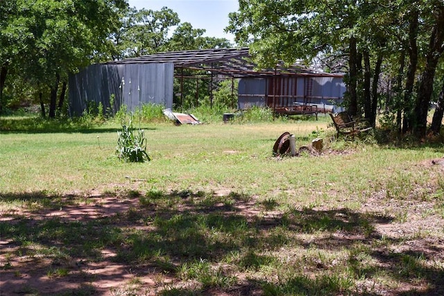 300746 Mcaly Rd, Foster, OK 73434 - view of grassy yard with an outbuilding