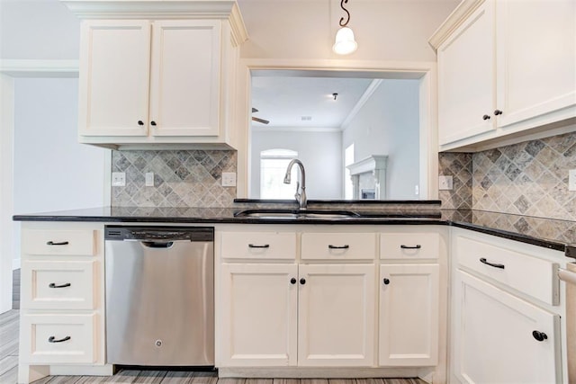 kitchen with crown molding, backsplash, white cabinets, and dishwasher