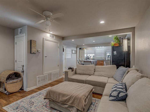 1072 County St Unit 2958, Tuttle, OK 73089 - living room featuring wood finished floors, ceiling fan, recessed lighting, and baseboards