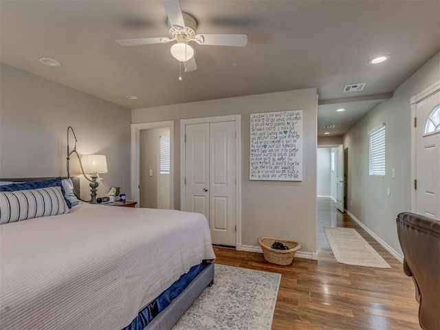 1072 County St Unit 2958, Tuttle, OK 73089 - bedroom with wood finished floors, a closet, baseboards, a ceiling fan, and recessed lighting