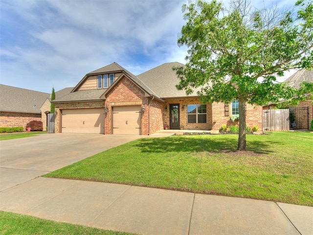 1808 Lago Dr, Moore, OK 73160 - view of front of house featuring brick siding, driveway, an attached garage, and roof with shingles