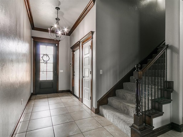 1808 Lago Dr, Moore, OK 73160 - tiled entryway with a chandelier, crown molding, stairway, and baseboards