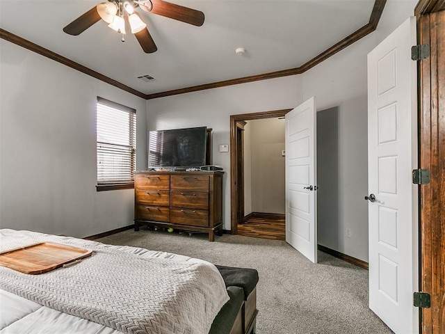 1808 Lago Dr, Moore, OK 73160 - carpeted bedroom featuring ornamental molding, baseboards, and ceiling fan