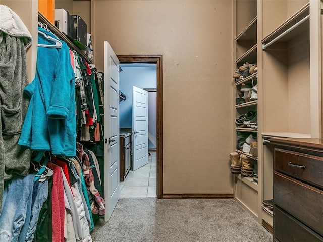1808 Lago Dr, Moore, OK 73160 - spacious closet with light colored carpet and light tile patterned flooring
