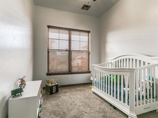 1808 Lago Dr, Moore, OK 73160 - bedroom with carpet floors, a crib, and baseboards