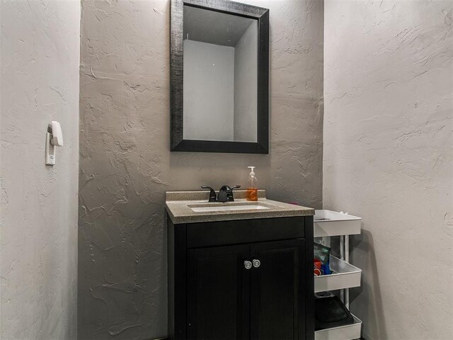 1808 Lago Dr, Moore, OK 73160 - bathroom with vanity and a textured wall