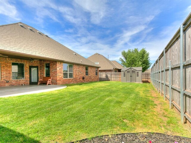 1808 Lago Dr, Moore, OK 73160 - view of yard featuring a storage shed, a patio area, and an outbuilding