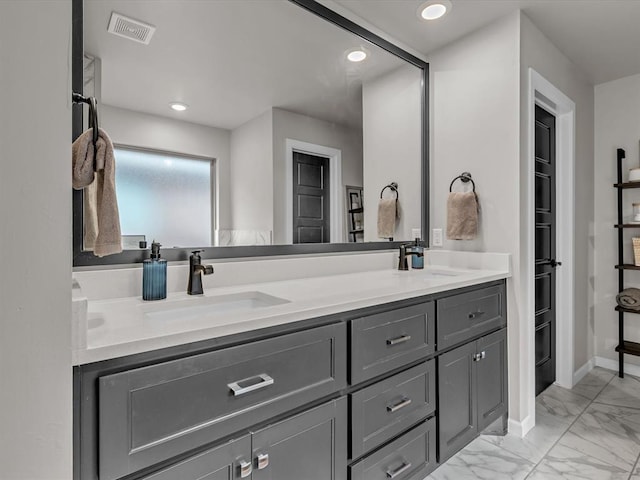 8332 Poplar Dr, Edmond, OK 73034 - full bathroom with double vanity, marble look tiles, and recessed lighting