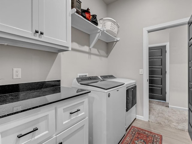8332 Poplar Dr, Edmond, OK 73034 - laundry area with separate washer and dryer, light wood-type flooring, and cabinet space