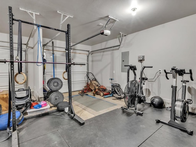 8332 Poplar Dr, Edmond, OK 73034 - workout area with electric panel and a garage