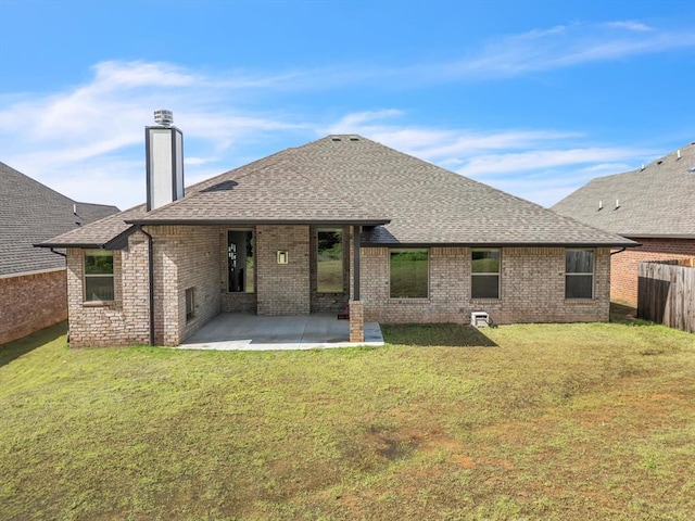 8332 Poplar Dr, Edmond, OK 73034 - back of property featuring roof with shingles, brick siding, a patio, and a chimney