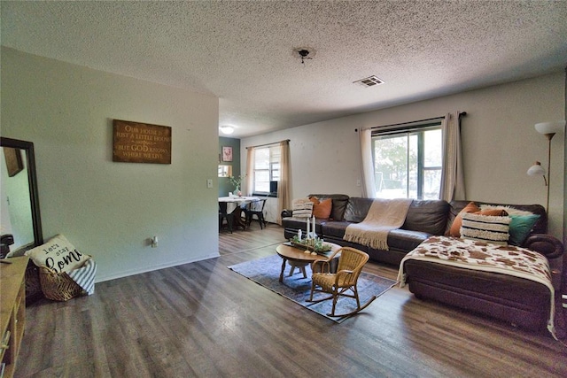 1208 Cathy Ln, Oklahoma City, OK 73110 - living area with wood finished floors and a textured ceiling