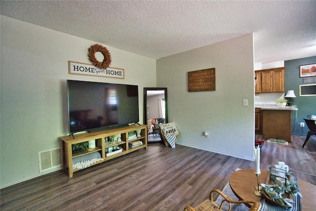 1208 Cathy Ln, Oklahoma City, OK 73110 - living room with a textured ceiling, dark wood finished floors, and baseboards