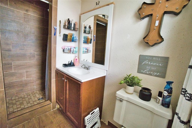 1208 Cathy Ln, Oklahoma City, OK 73110 - full bath featuring a shower stall, vanity, toilet, and wood finished floors
