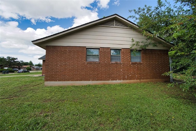 1208 Cathy Ln, Oklahoma City, OK 73110 - view of side of home with a lawn and brick siding