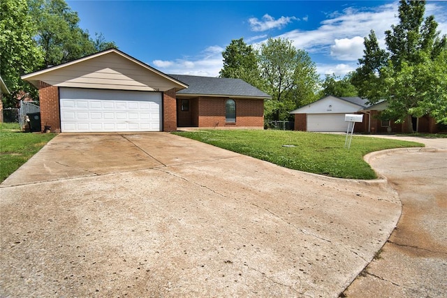 1208 Cathy Ln, Oklahoma City, OK 73110 - ranch-style house with brick siding, a front lawn, concrete driveway, and an attached garage