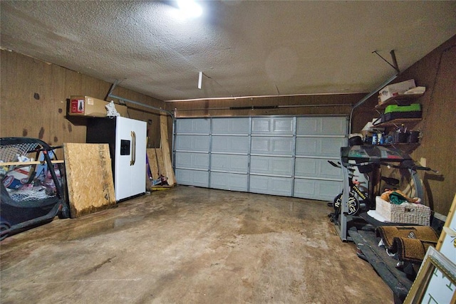 1208 Cathy Ln, Oklahoma City, OK 73110 - garage featuring wooden walls