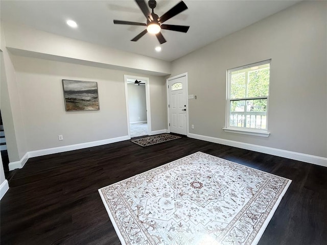 foyer entrance with a ceiling fan, dark wood-type flooring, baseboards, and recessed lighting