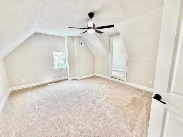 bonus room featuring carpet, lofted ceiling, ceiling fan, and baseboards