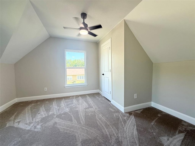 bonus room with lofted ceiling, carpet floors, ceiling fan, and baseboards