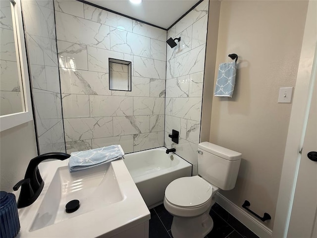 full bath with toilet, a sink,  shower combination, and baseboards