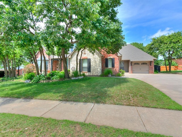 3133 Beacon Hill St, Edmond, OK 73034 - view of front facade featuring a garage, concrete driveway, brick siding, and stone siding