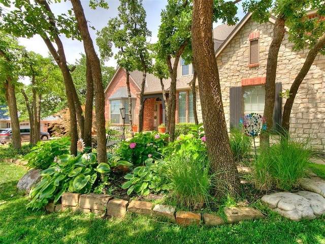 3133 Beacon Hill St, Edmond, OK 73034 - view of front of property with stone siding and a shingled roof