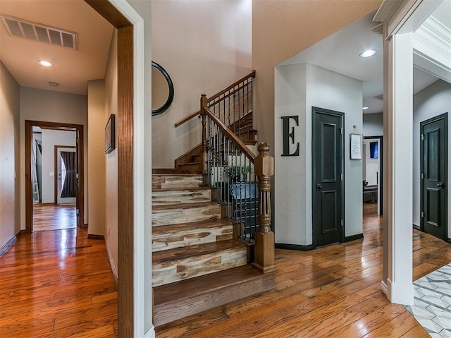 3133 Beacon Hill St, Edmond, OK 73034 - stairway featuring hardwood / wood-style floors and recessed lighting